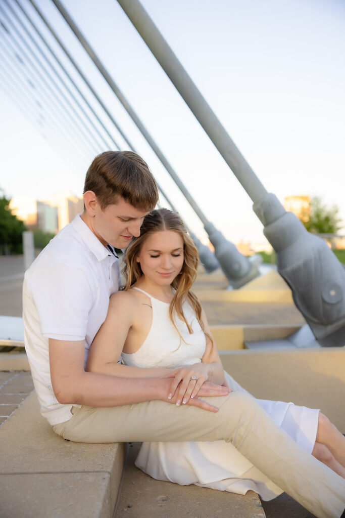 Engaged couple at looking at ring