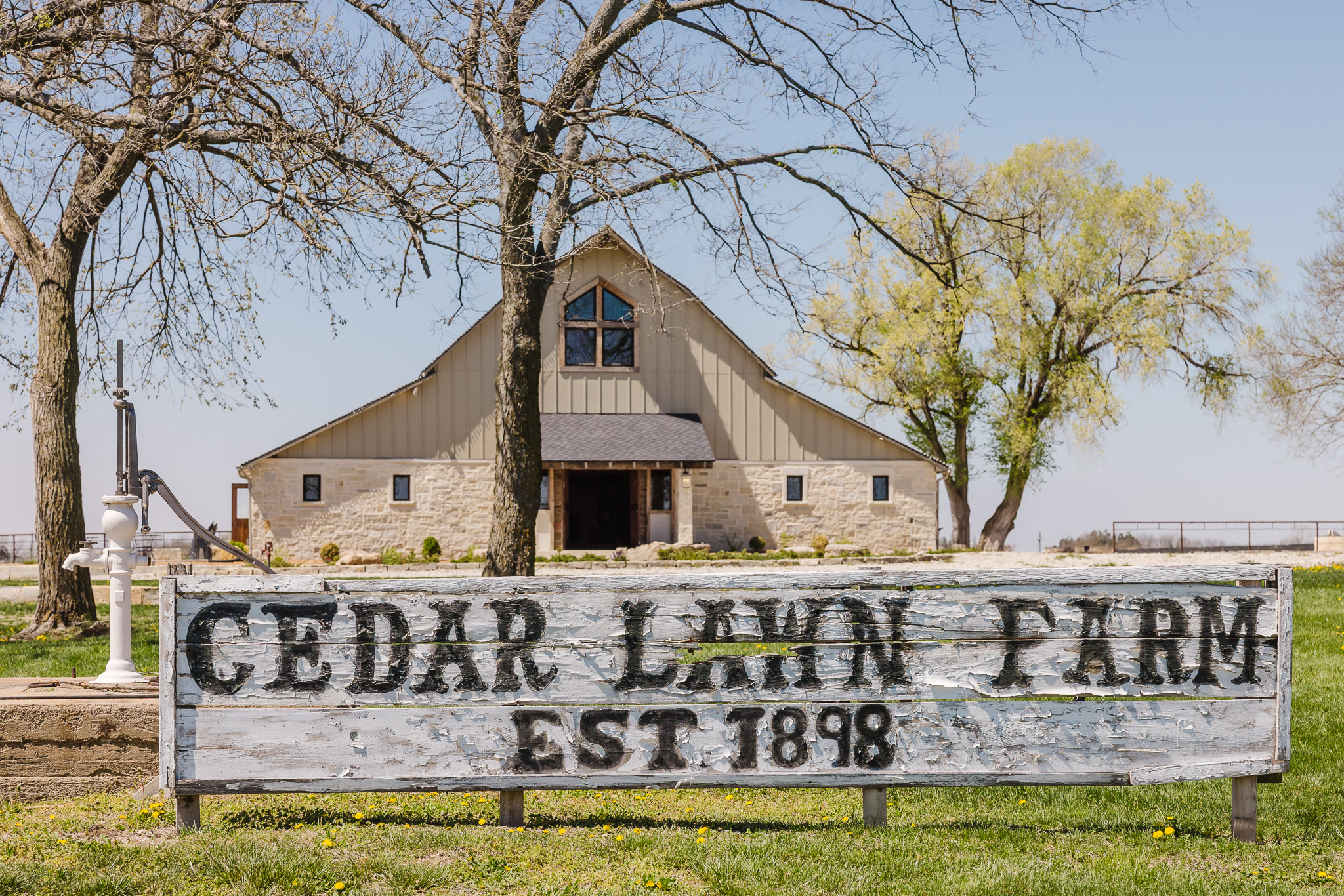 wedding venue with original sign in front stating it has been established over 100 years ago