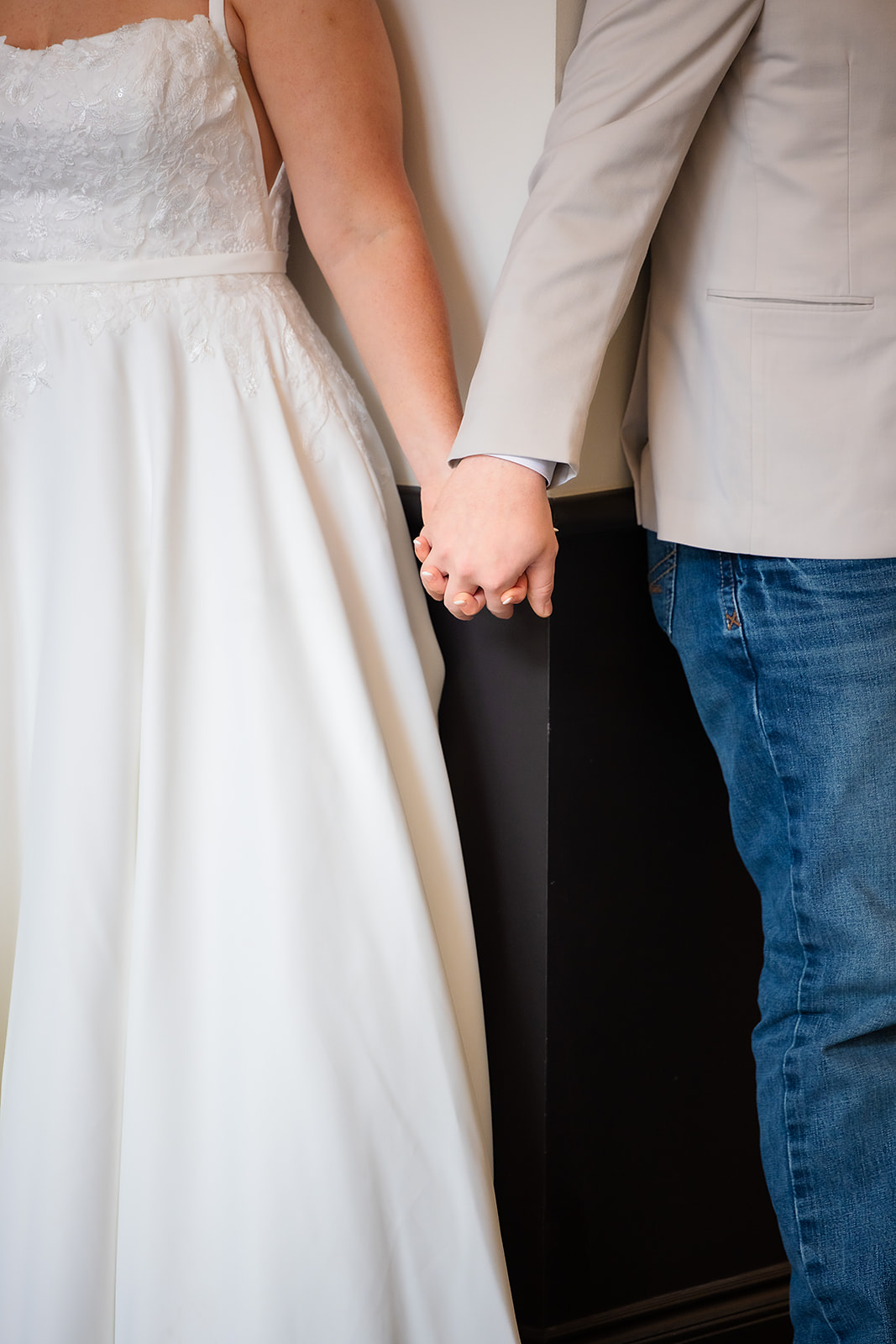 First touch with bride and groom holding hands
