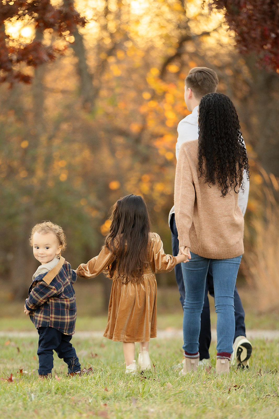 parents walking toddlers wearing cute fall colors
