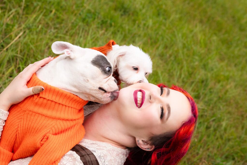 Dog mom getting kisses during photoshoot