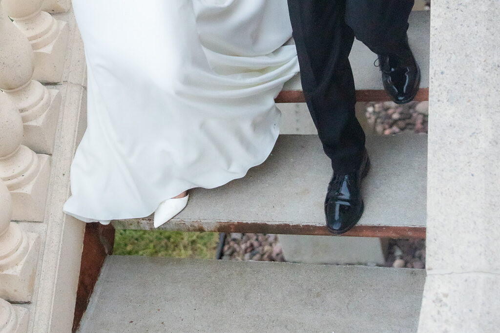 Bride and Groom walking down stairs
