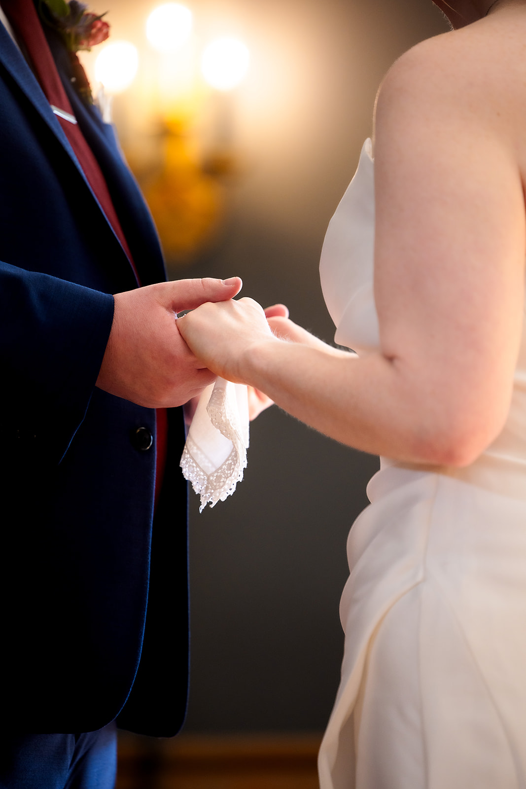bride and groom holding hands during first look