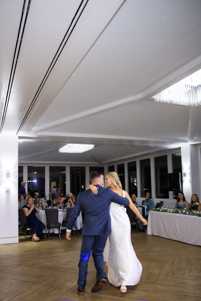 First Dance with Bride and Groom at Townsite 16 Venue showing beautiful windows and a crystal chandelier