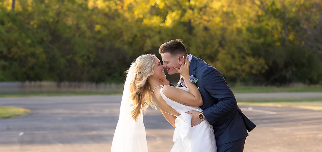 Bride and Groom kissing passionately at golden hour
